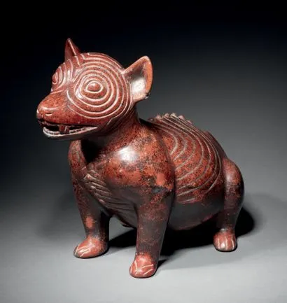 Colima crouching dog from Mexico and made of redware ceramic offered in the auction.