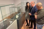 The mayor of Antequera, Manolo Barón, the deputy mayor delegate for Historical Heritage, Ana Cebrián, as well as the municipal archaeologist and director of the Museum of the City of Antequera (MVCA), Manuel Romero stand next to several items from an ancient Roman necropolis in glass display cases during a press conference on their discovery on November 10, 2022.