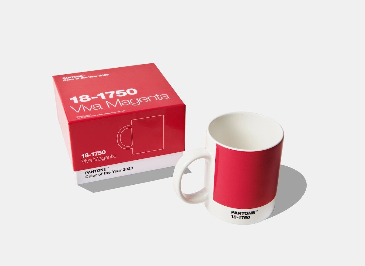 A mug and an accompanying box in a shade of deep red that also has some pink in it.