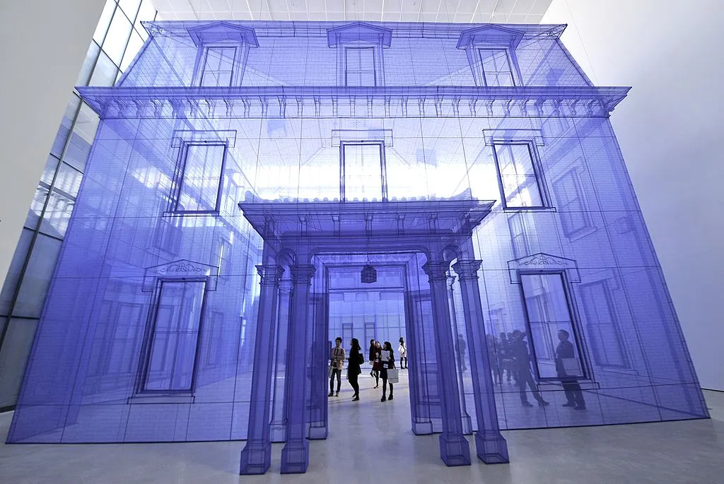 Purple transparent model home installed in art gallery.
