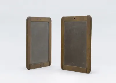 A sculpture made of two small blackboards.