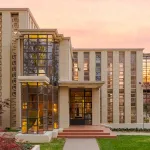 A photo of a rectangular building during sunset.