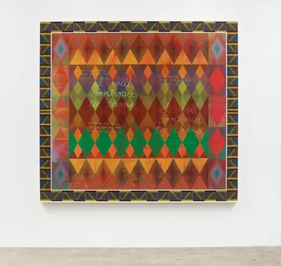 A painting that has various colors and also incorporates glass beads and artificial sinew with a custom frame. 