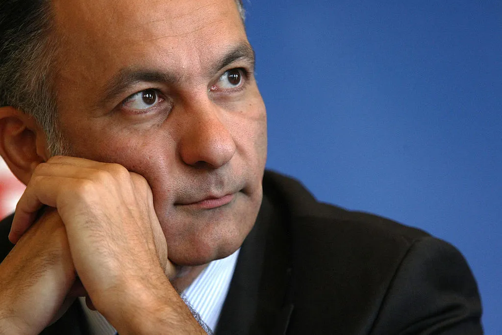 A close up of a man in a suit.