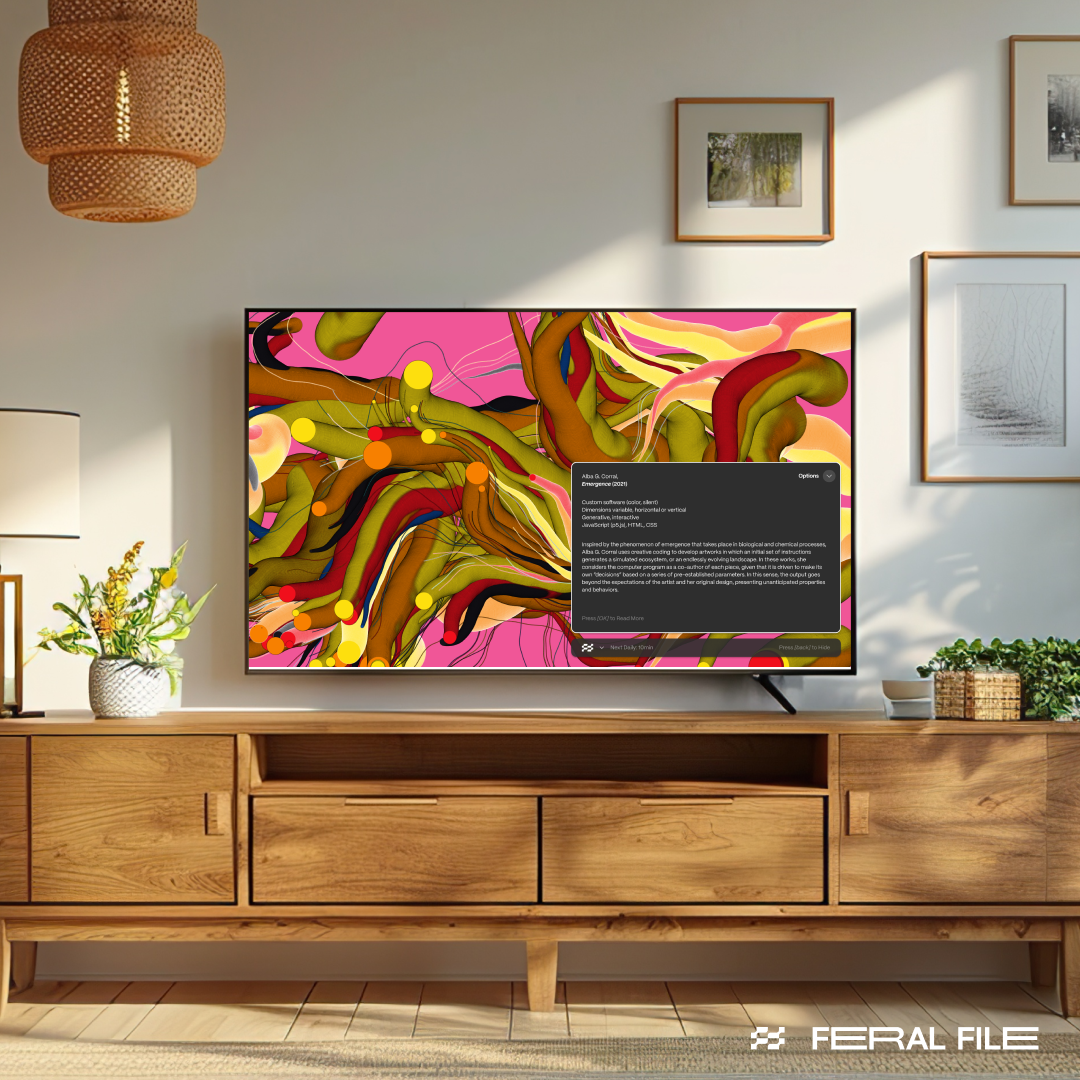 A TV on a table in a room with white walls and pictures on the wall.