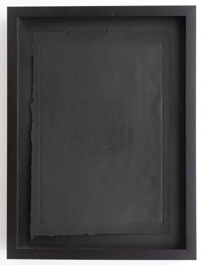 An artwork that is all black with a black frame and matting. In the center of the page is an embossed ad seeking for more information on a formerly enslaved person.