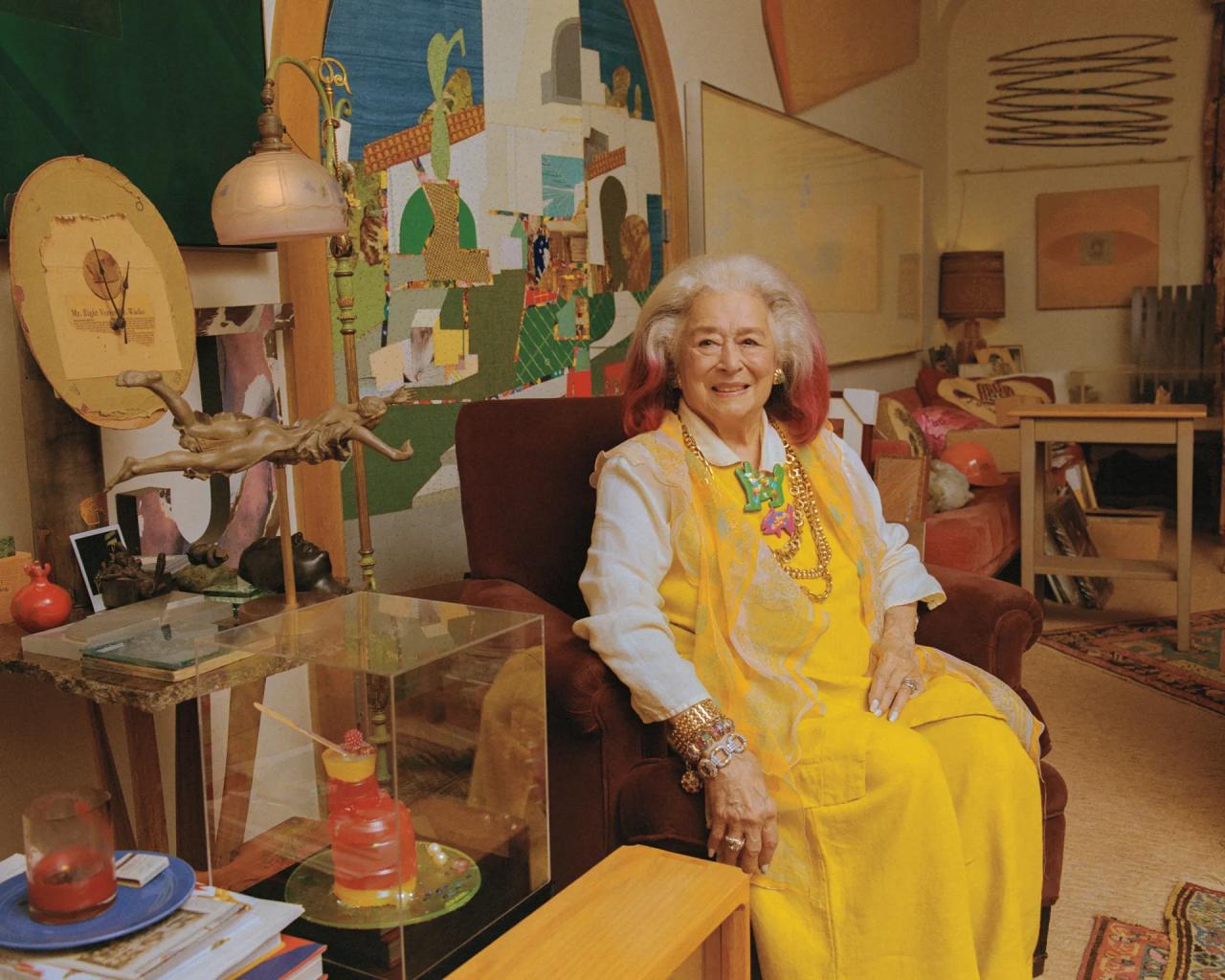 Portrait of Joan Agajanian Quinn, sitting in an armchair