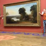 two men with their hands glued to the gilt frame of a painting.