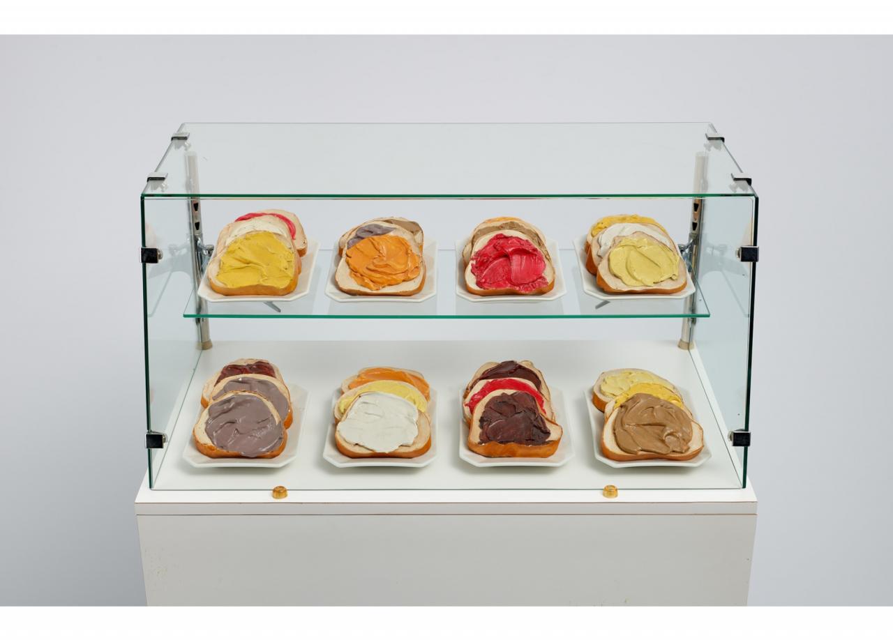sandwiches in glass case.
