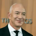 A bald white man in a suit.
