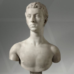 A marble bust of a young, sharp looking, man.