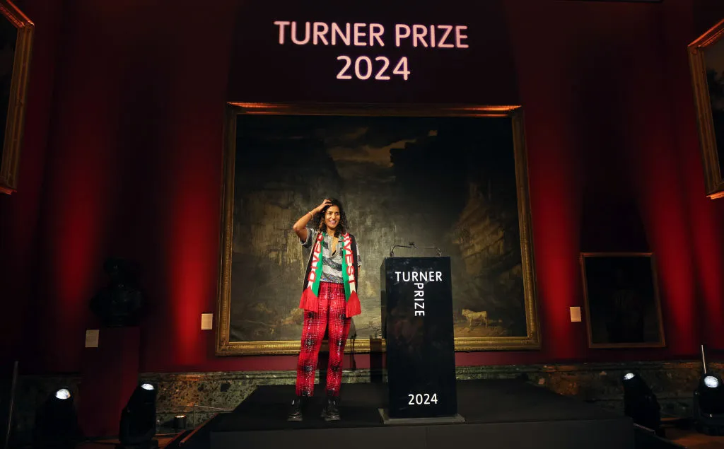 A woman stands on stage.