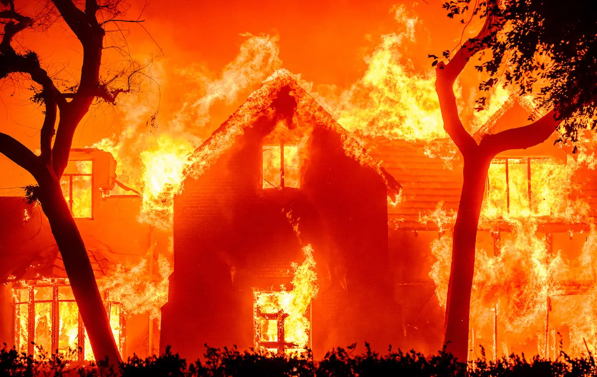 A house engulfed in flames.