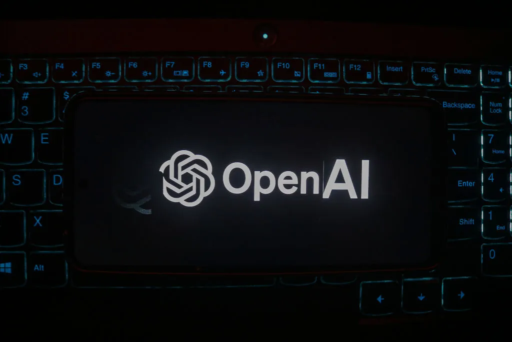 The OpenAI logo is displayed on a mobile phone next to a computer keyboard in Srinagar, Jammu and Kashmir, on January 30, 2025. (Photo Illstration by Firdous Nazir/NurPhoto via Getty Images)