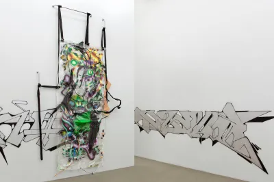 An abstract painting on plastic hanging on a wall.
