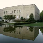 A front view of the Everhart Museum in Scranton, PA, including its reflecting pool, where two of the crime ring