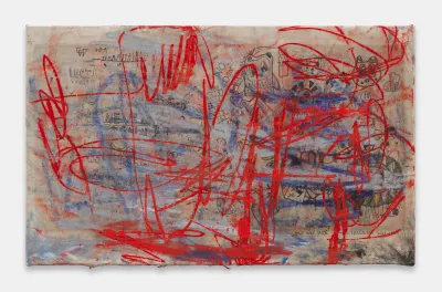 An abstract painting with blue and red scrawls over graffiti-like images.