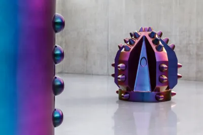 A purple sculpture resembling an enlarged drill head.