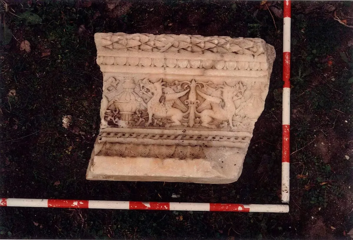 An alabaster stone fragment on the ground