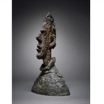 A jagged bronze bust of a man.
