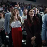 CONWAY, SOUTH CAROLINA - FEBRUARY 10: Trump supporters Siggy Flicker (L) and far-right activist Laura Loomer listen as Republican presidential candidate and former President Donald Trump speaks during a Get Out The Vote rally at Coastal Carolina University on February 10, 2024 in Conway, South Carolina. South Carolina holds its Republican primary on February 24. (Photo by Win McNamee/Getty Images)