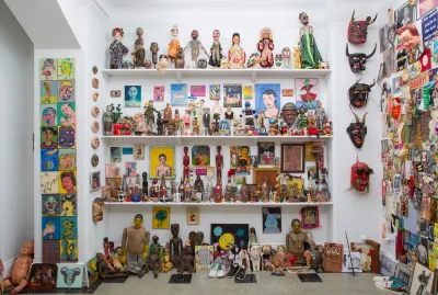 A gallery exhibition consisting of a collection of hundreds of dolls, paintings, drawings, masks, postcards, other objects.