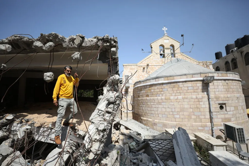 GAZA CITY, GAZA - JUNE 3: Palestinian Christian Ramez Al-Souri, who lost his 3 children Suhail, Julie and Majd and many relatives in the Israeli attack shows the destroyed historic Greek Orthodox Church of St. Porphyrius at the Ez-Zeytun neighbourhood in Gaza City, Gaza on June 3, 2024. (Photo by Hamza Z. H. Qraiqea/Anadolu via Getty Images)