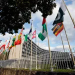 PARIS, FRANCE - OCTOBER 11:  Flags from several countries float in front of the headquarters of the United Nations Educational, Scientific and Cultural Organization (UNESCO) on October 11, 2017 in Paris, France. From this Monday, the 58 members of the Executive Board of Unesco will vote by secret ballot at the headquarters of the organization to elect their new Director General. Several ballots are scheduled and the name of the new Director General of UNESCO will be announced on November 10.  (Photo by Chesnot/Getty Images)