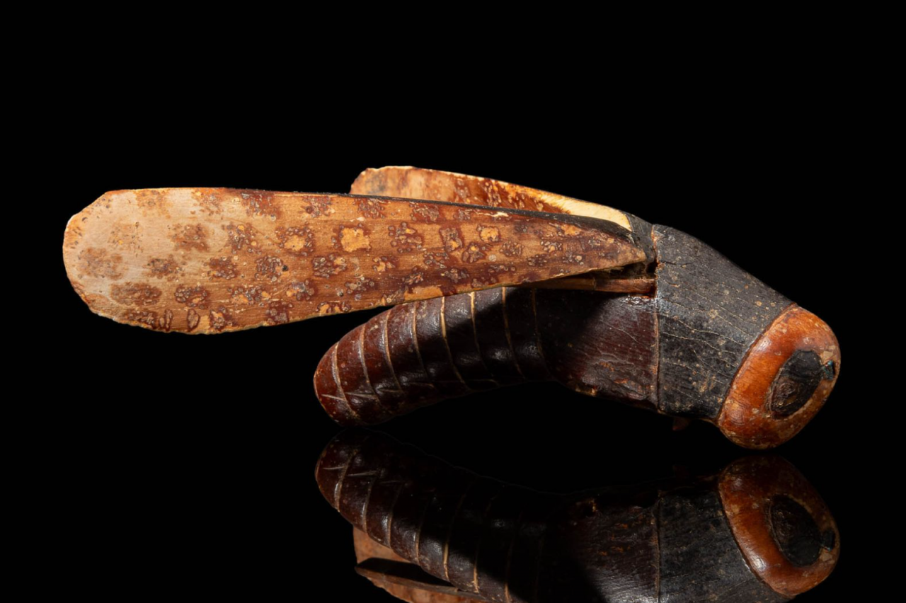 An intricately carved grasshopper made of ivory and wood being auctioned by Apollo Art Auctions has an estimate of £300,000 to £500,000. Experts believe it was stolen from King Tutankhamen’s tomb.