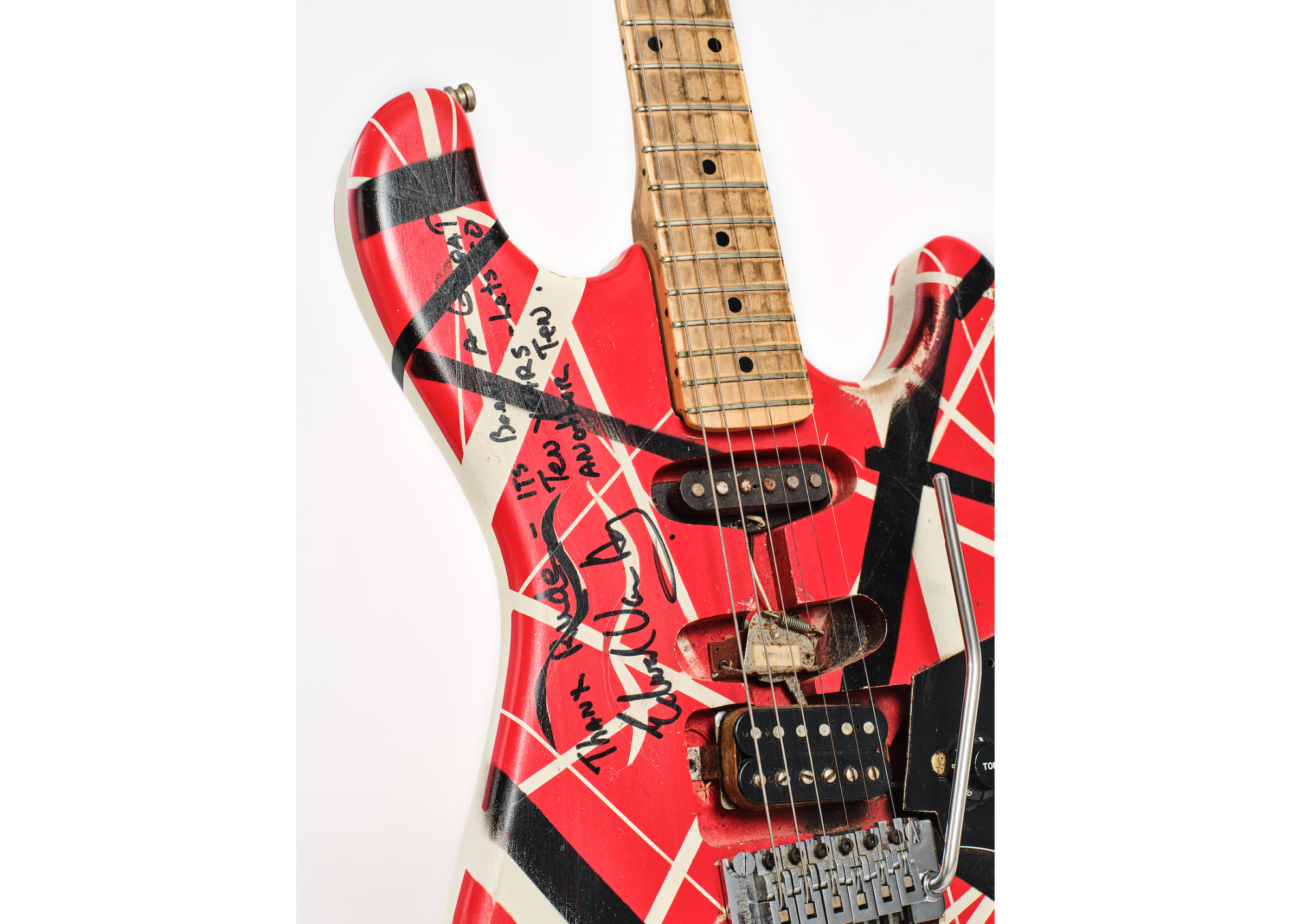 A Stratocaster style guitar with a red body and seemingly random red and white bars of varying thickness shooting across it.