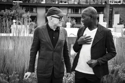 Candid photo of curator Hans Ulrich Obrist (left) and architect Francis Kéré.