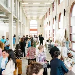 Visitors peruse the art on view at Conductor art fair.