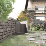Outdoor area with tables and stone wall.