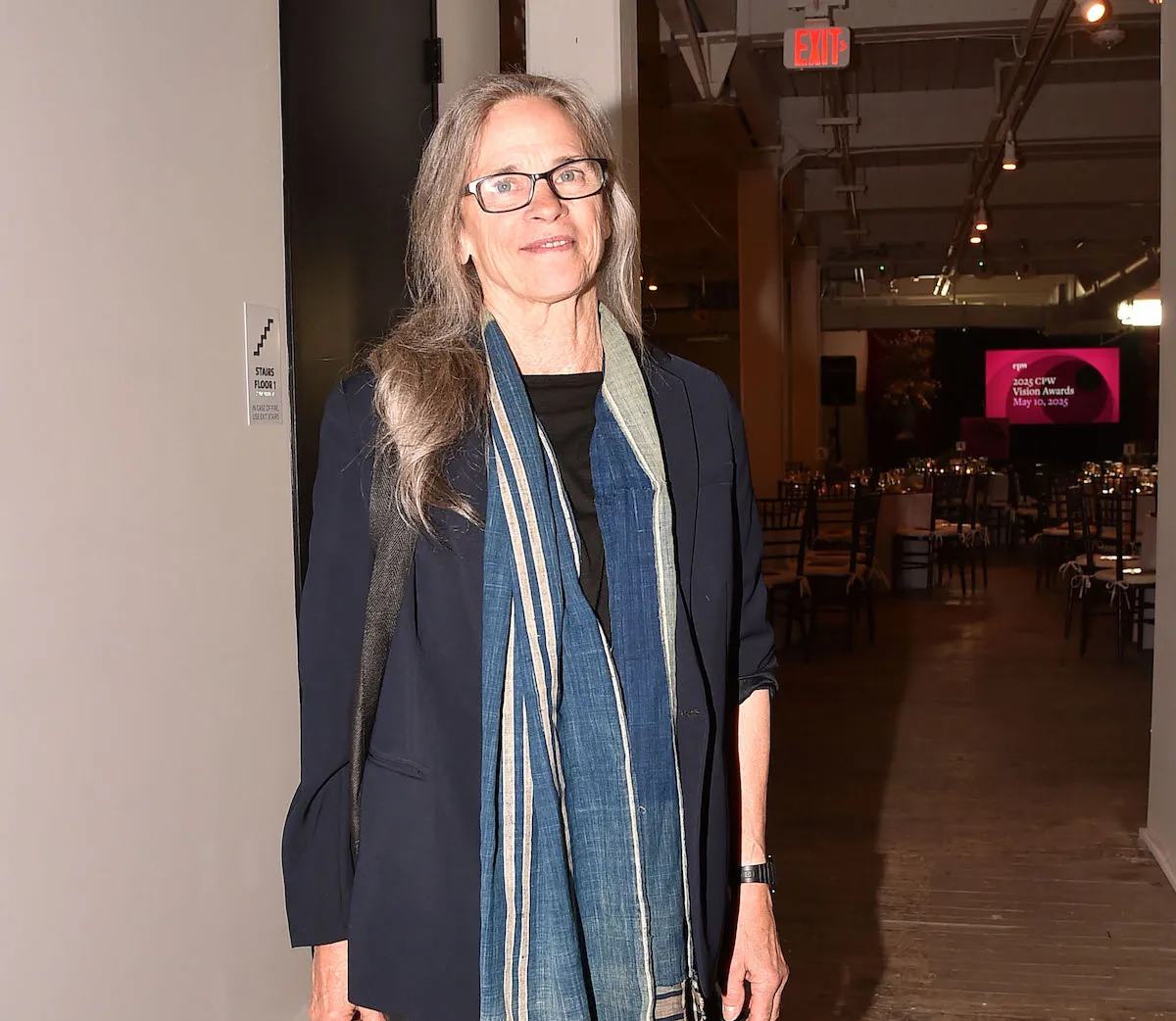 A woman standing in an event space.