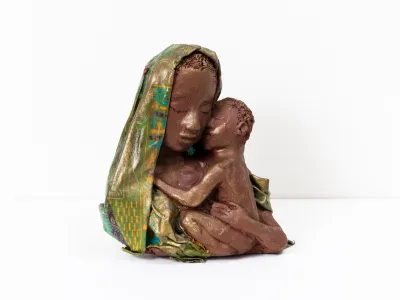 A sculpture of a Black madonna and child.