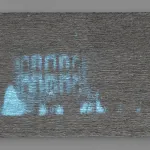 An abstract painting that is mostly gray and made of dozens of layers of oil paint has a grainy image of the White House projected on it.