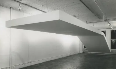 A large white sculpture suspended from the ceiling.