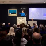 An auctioneer sells "California (IKB 71)" at Christie