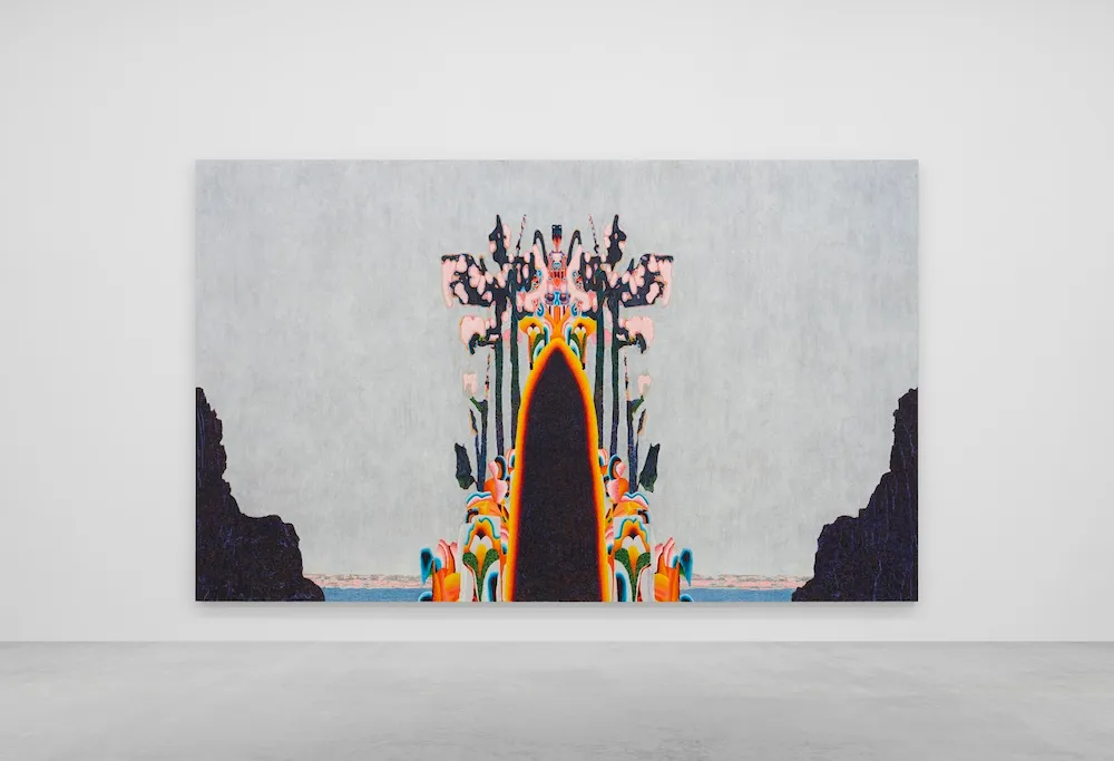 A colorful figure seems to emerge out of the ground in front of a grey sky.