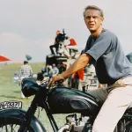 Actor Steve McQueen sitting astride a motorcycle in a publicity still for the 1963 film The Great Escape.