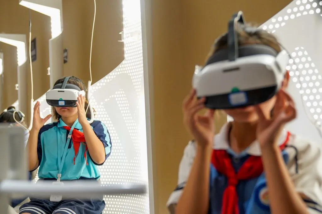 Visitors wear VR sets for exhibitions at the Wei and Jin Dynasties Ancient Tombs Site Museum in Kuqa City, northwest China