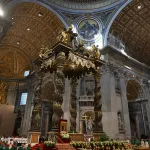A picture shows the newly renovated baldachin, a large Baroque sculpted bronze canopy over the high altar of St. Peter