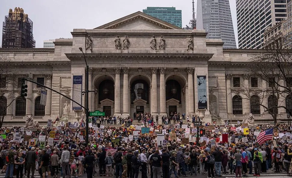 NEW YORK, NEW YORK - APRIL 19: People take part in a protest outside of New York Public Library organised to
