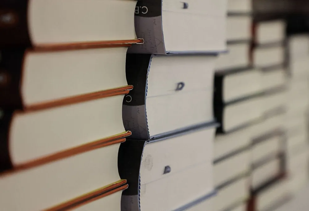 Books stacked on a shelf.