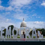 Members of the National Guard walk by a 3,000-pound ice sculpture by artists Nora Ligorano and Marshall Reese on the National Mall in Washington, DC, 2025.