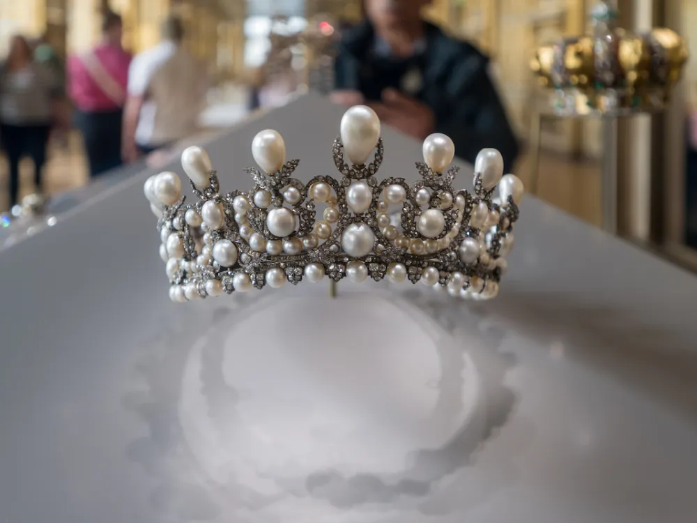 A bejeweled crown in a display case.
