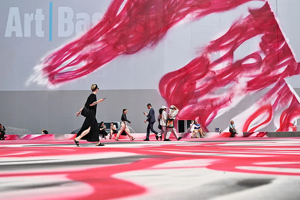 Visitors walk past Katharina Grosse