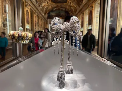 PARIS, FRANCE - OCTOBER 21: Sets of sumptuous jewelry, including crown, and large bodice bow of Empress Eugénie, are on display at the Louvre Museum on October 21, 2023 in Paris, France. The Louvre reopened its doors to visitors in Paris on October 22, 2025, the museum said on its website, three days after thieves stole jewels worth around €88 million (2 million) in a daring daytime heist. (Photo by Zhang Mingming/VCG via Getty Images)