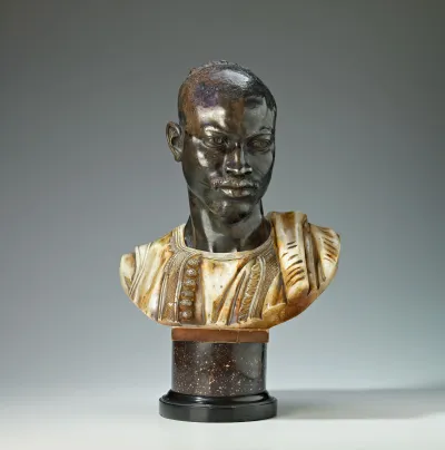 A bust of a Sudanese man.