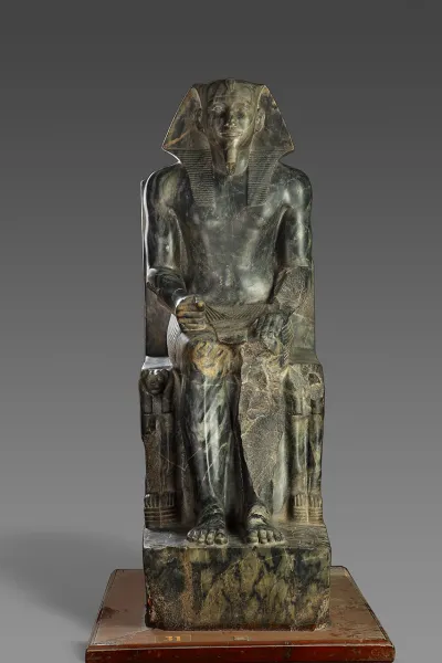 An anorthosite gneiss sculpture of a pharaoh enthroned.